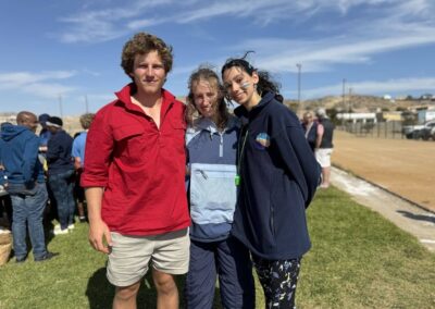 three people smiling for a picture in Namibia