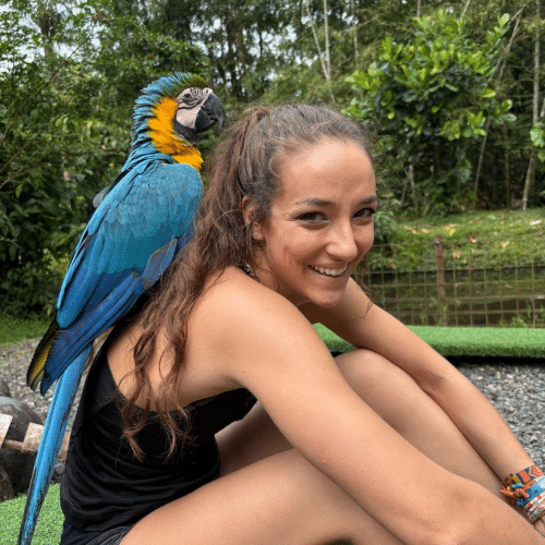 Carly with bird at wildlife rescue project in Ecuador