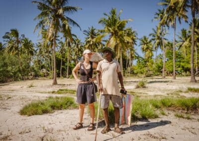 A man and a woman stand outside.