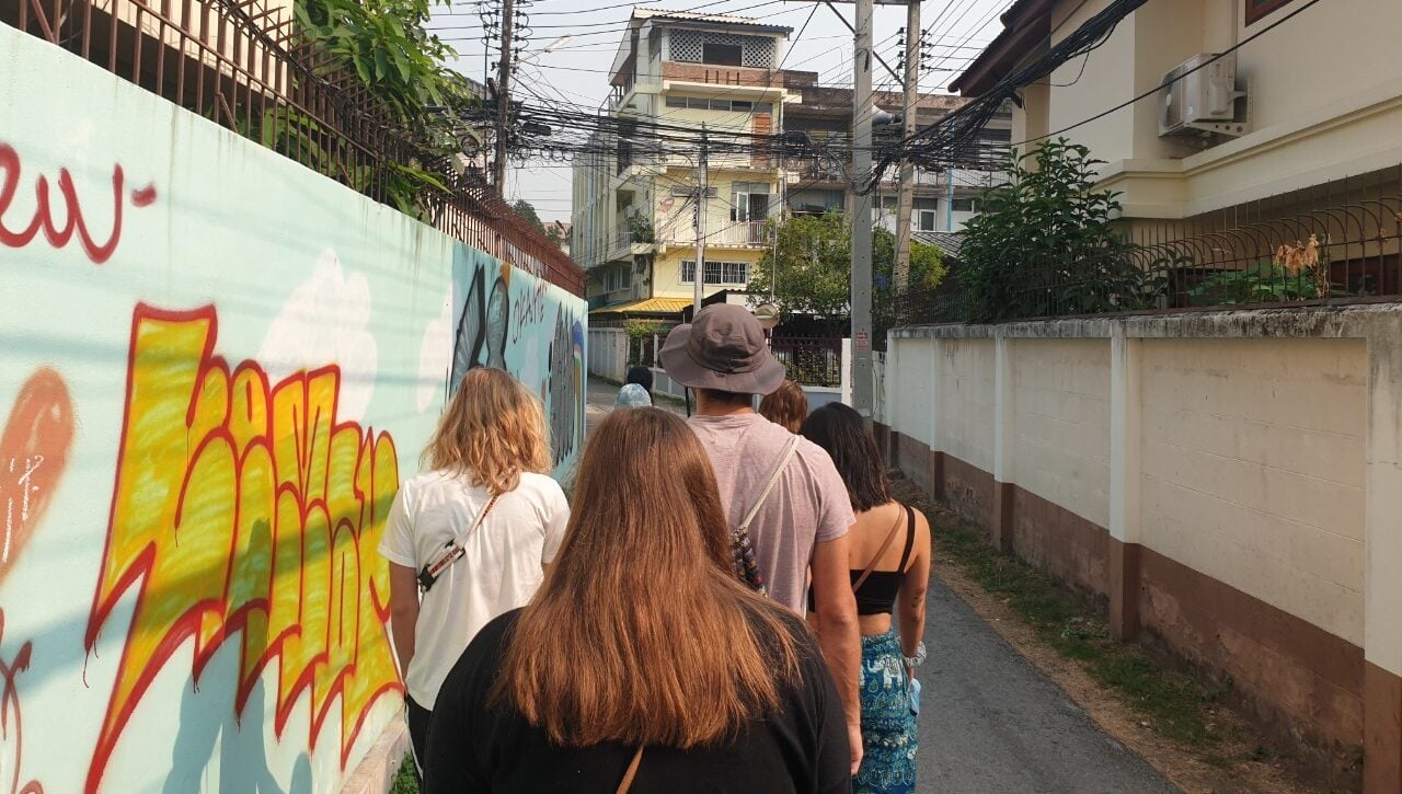 Walking with group in alley